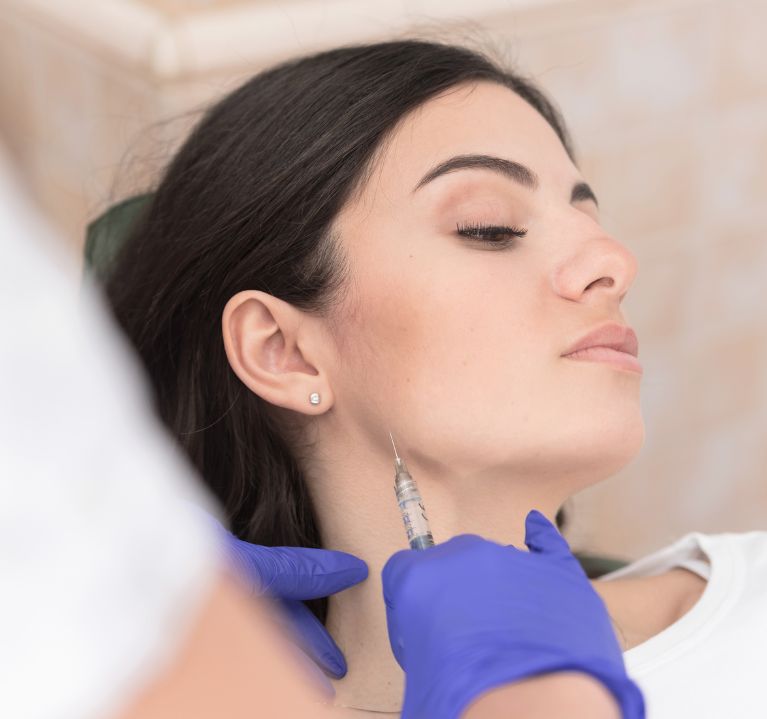 Picture of a woman receiving a TMJ botox treatment in Huntington, NY