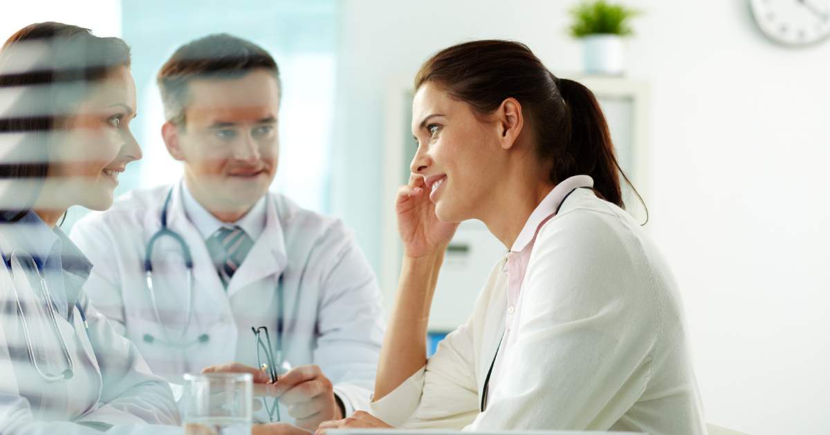 A patient talking to physicians.
