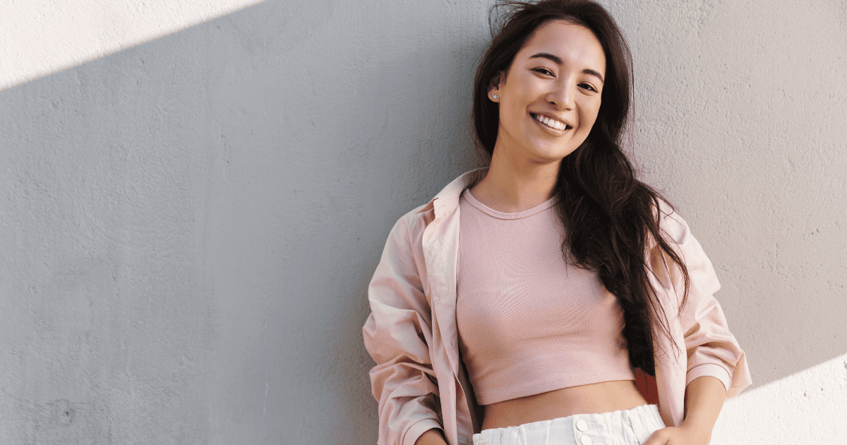 A fit woman smiling.