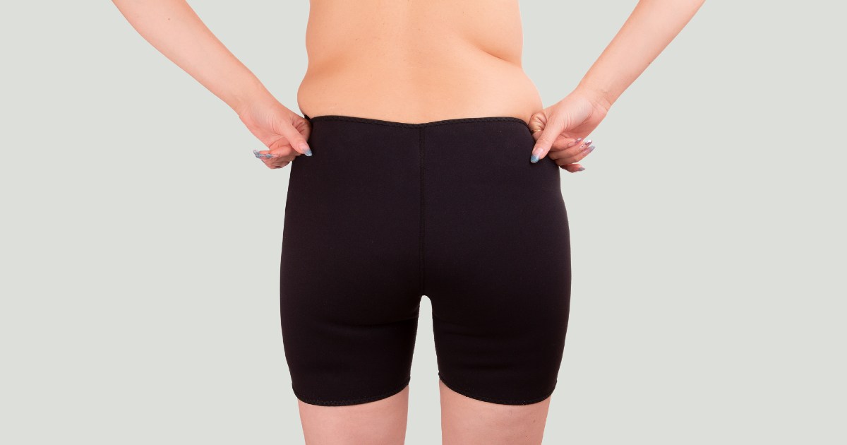 image of a woman with her hands on their waist
