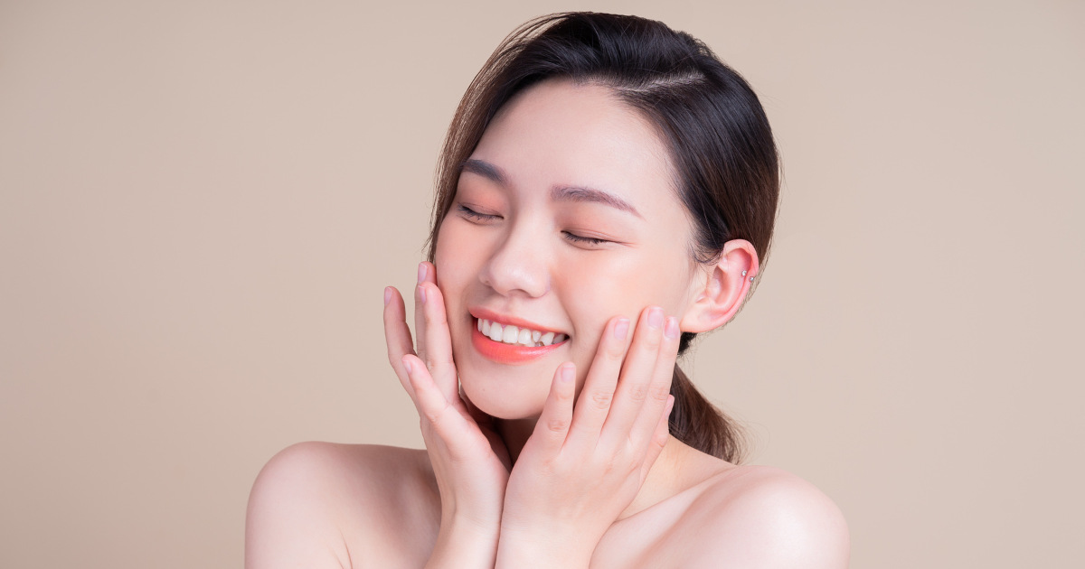 woman smiling with firm facial skin